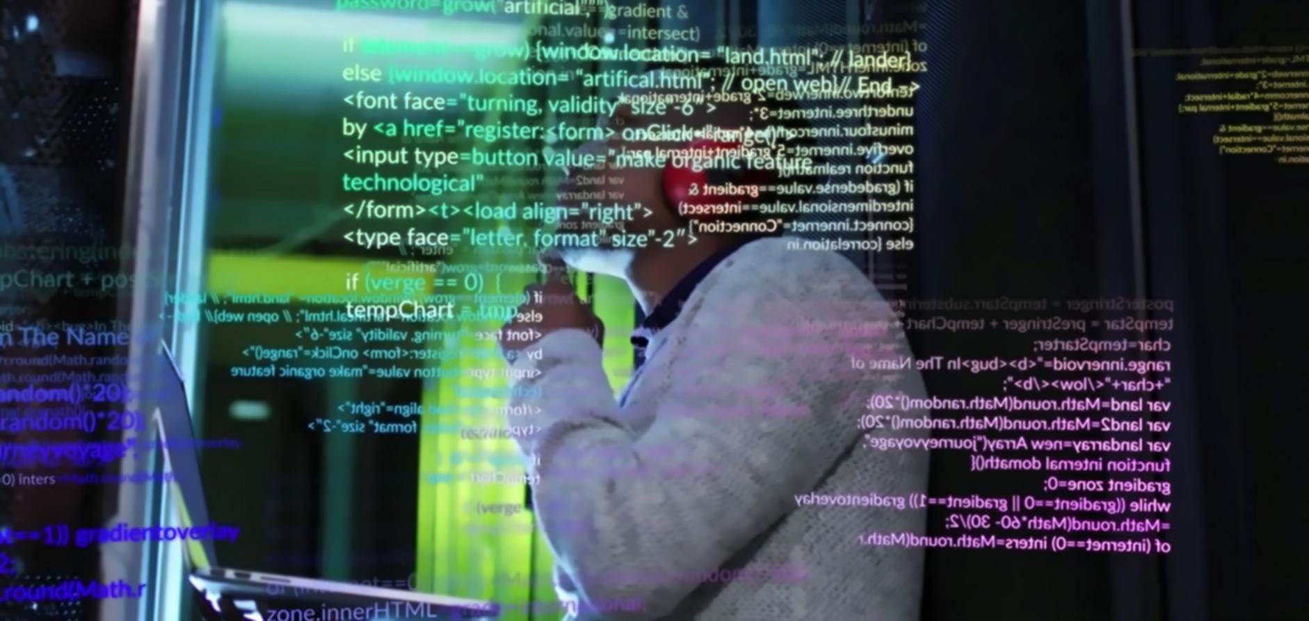 Advanced web design workshop with multiple monitors showing code and design interfaces
